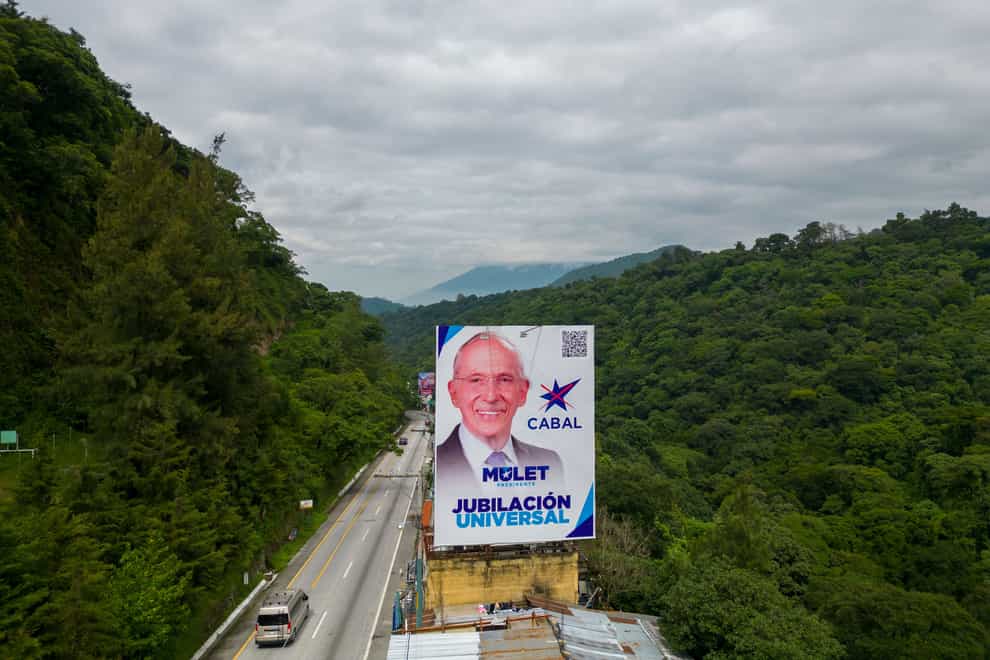 A campaign billboard promoting Edmond Mulet, who is the presidential candidate of the Cabal party, towers over a road in Santa Lucia Milpas Altas, Guatemala (Moises Castillo/AP)