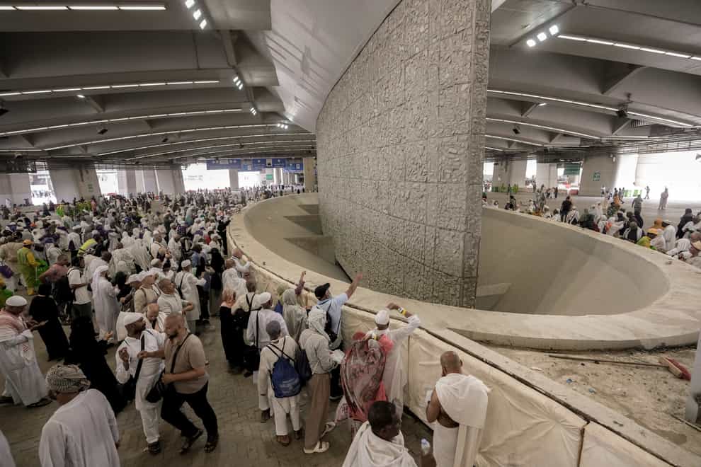 Pilgrims cast stones at a pillar in the stoning of the devil, the last rite of the annual Hajj pilgrimage, in Mina near the holly city of Mecca, Saudi Arabia (Amr Nabil/AP)