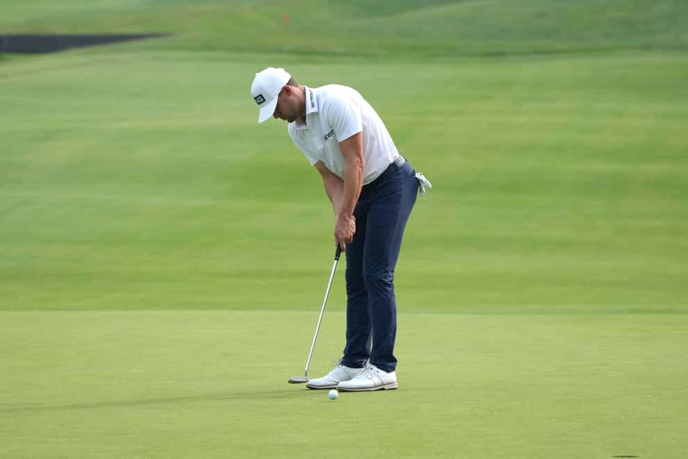 Taylor Moore putts on the 18th green during the first round of the Rocket Mortgage Classic golf tournament at Detroit Country Club (Carlos Osorio/ AP)