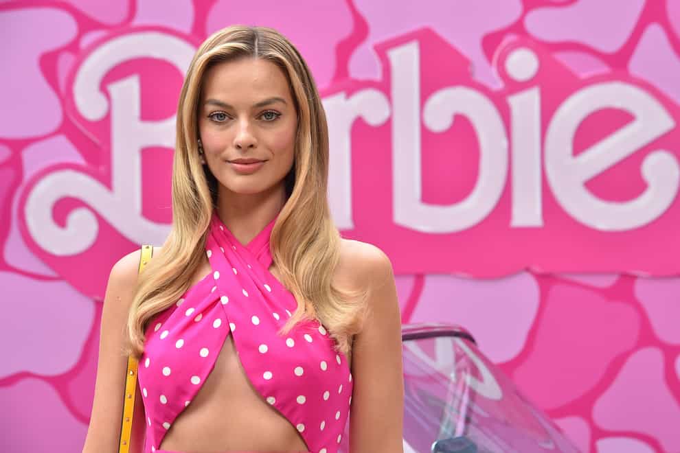 Margot Robbie has been channelling Barbie’s retro and pink-obsessed style for the press tour so far (Jordan Strauss/AP)