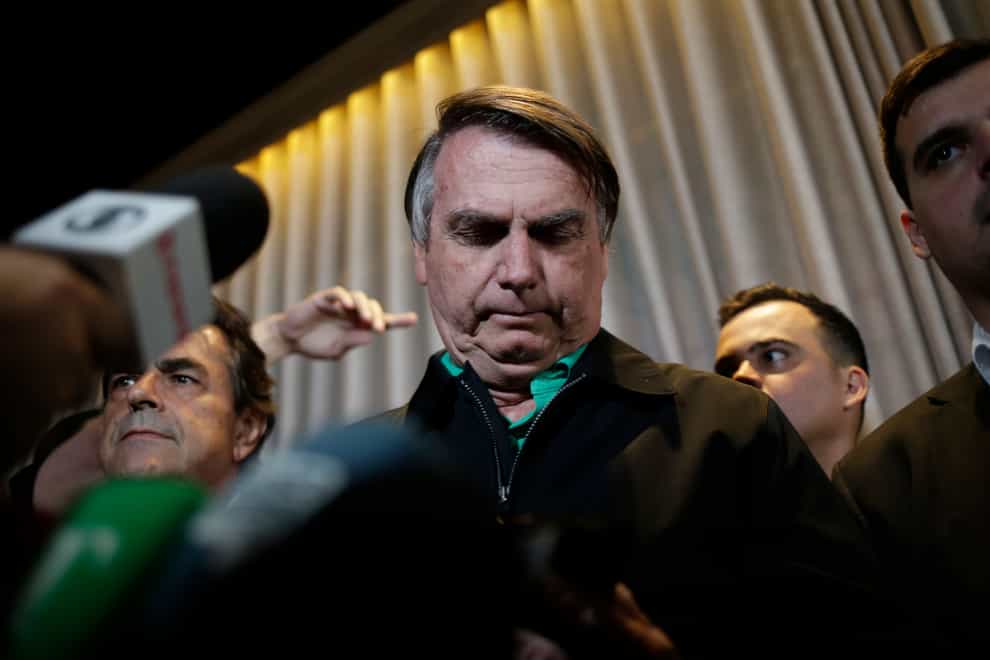 Former president Jair Bolsonaro speaks to the press on Friday (Thomas Santos/AP)