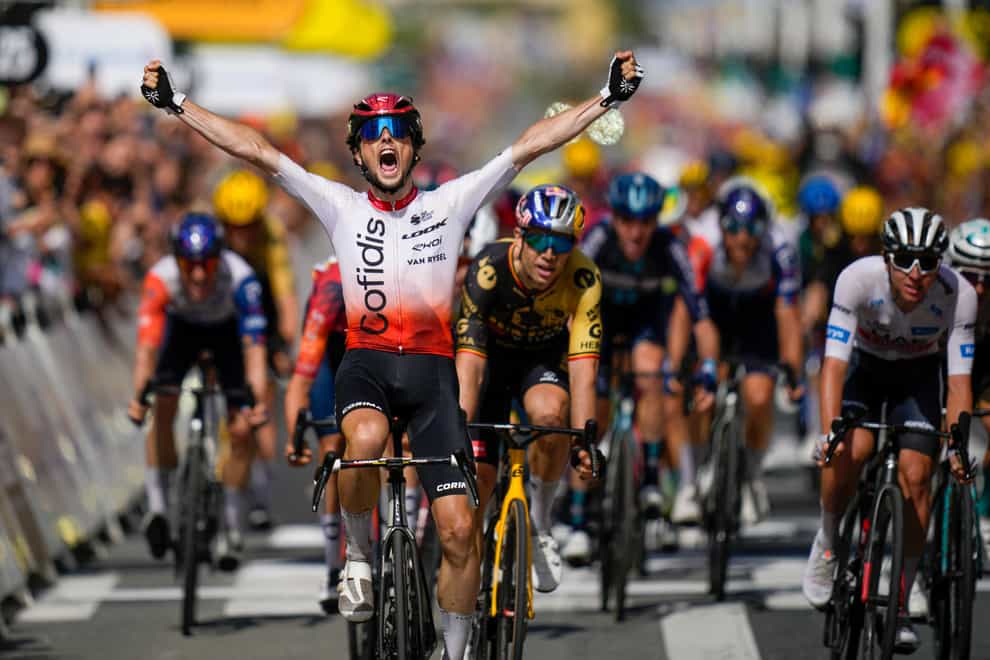 Victor Lafay held on to win stage two of the Tour de France thanks to a late attack (Daniel Cole/AP)