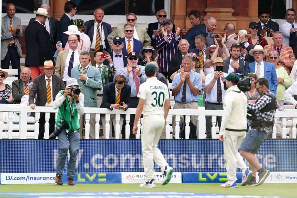 Pat Cummins walks off past MCC members at Lord’s during day five of the second Ashes Test (Mike Egerton/PA)