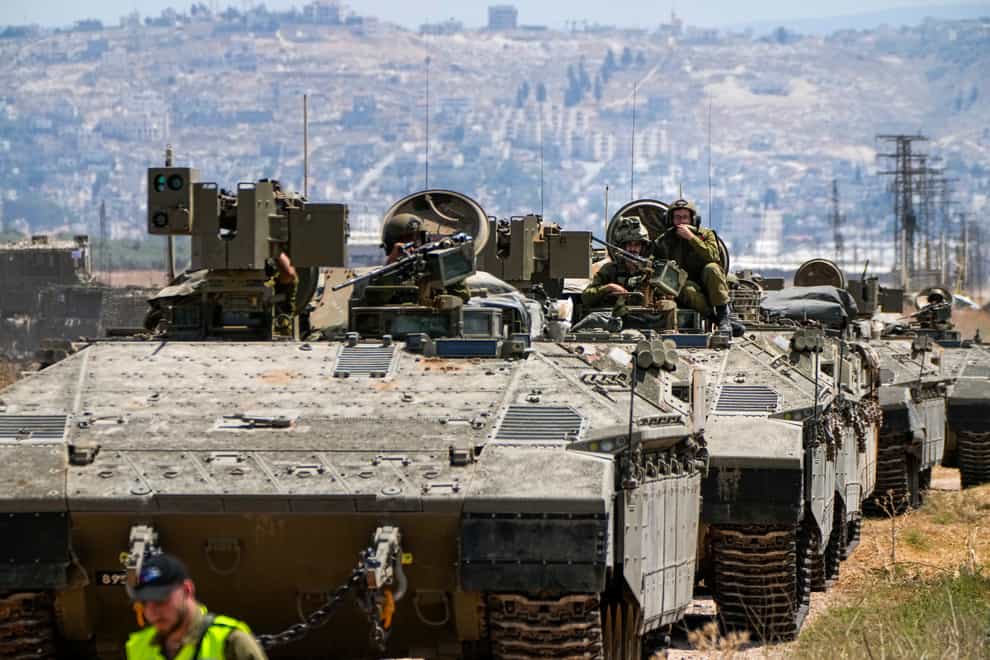 Israeli soldiers drive out of the occupied West Bank city of Jenin (Ariel Schalit/AP)