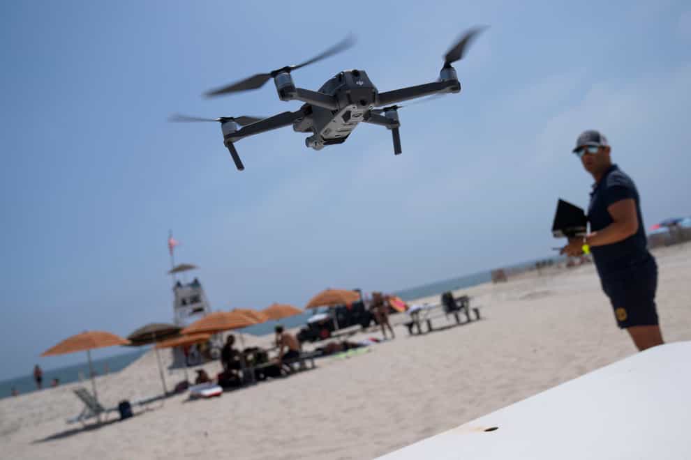 The drones make three sweeps each day (John Minchillo/AP)