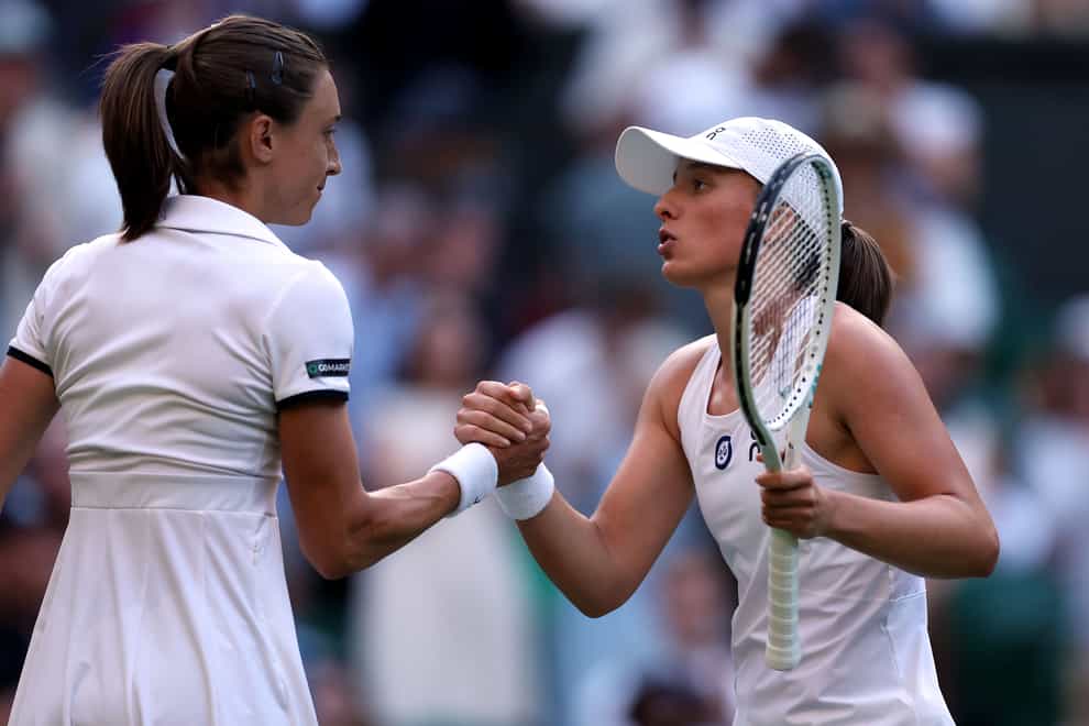 Iga Swiatek and Petra Martic shake hands after their third-round match at Wimbledon (Steven Paston/PA)