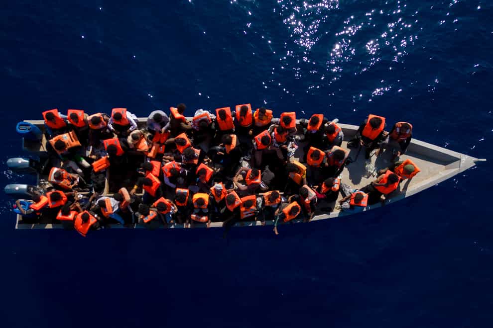 Migrants packed on a bot leave Libya (Joan Mateu Parra/AP)
