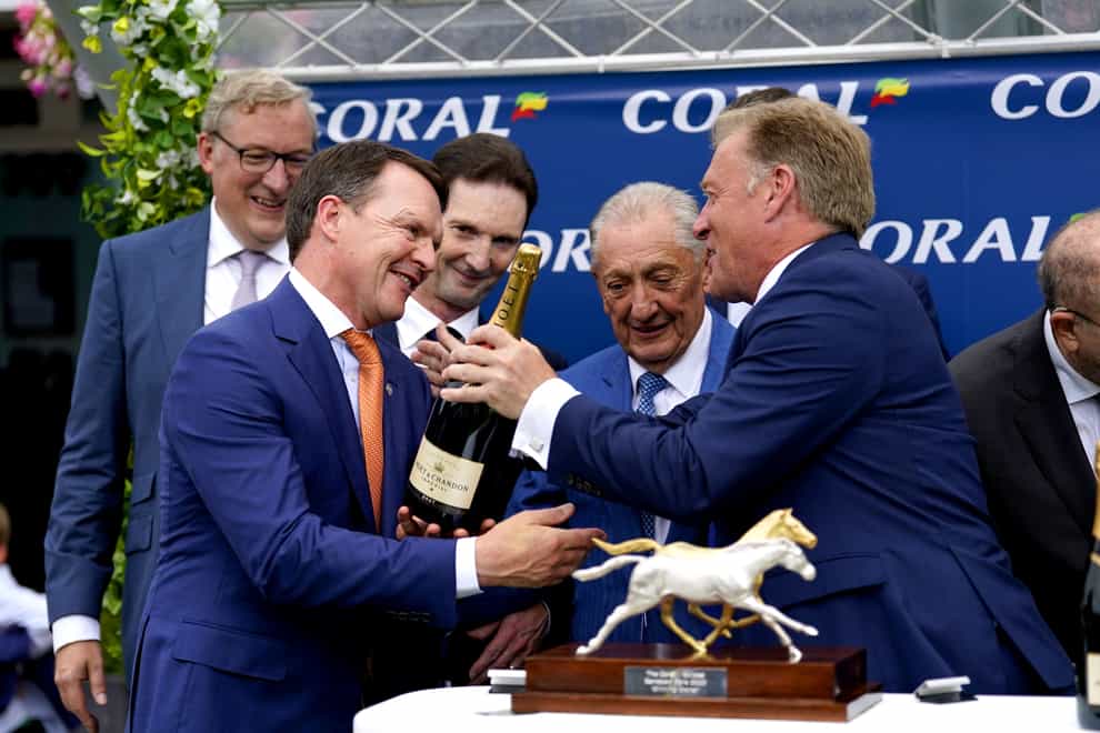 Trainer Aidan O’Brien receives his prize (Andrew Matthews/PA)