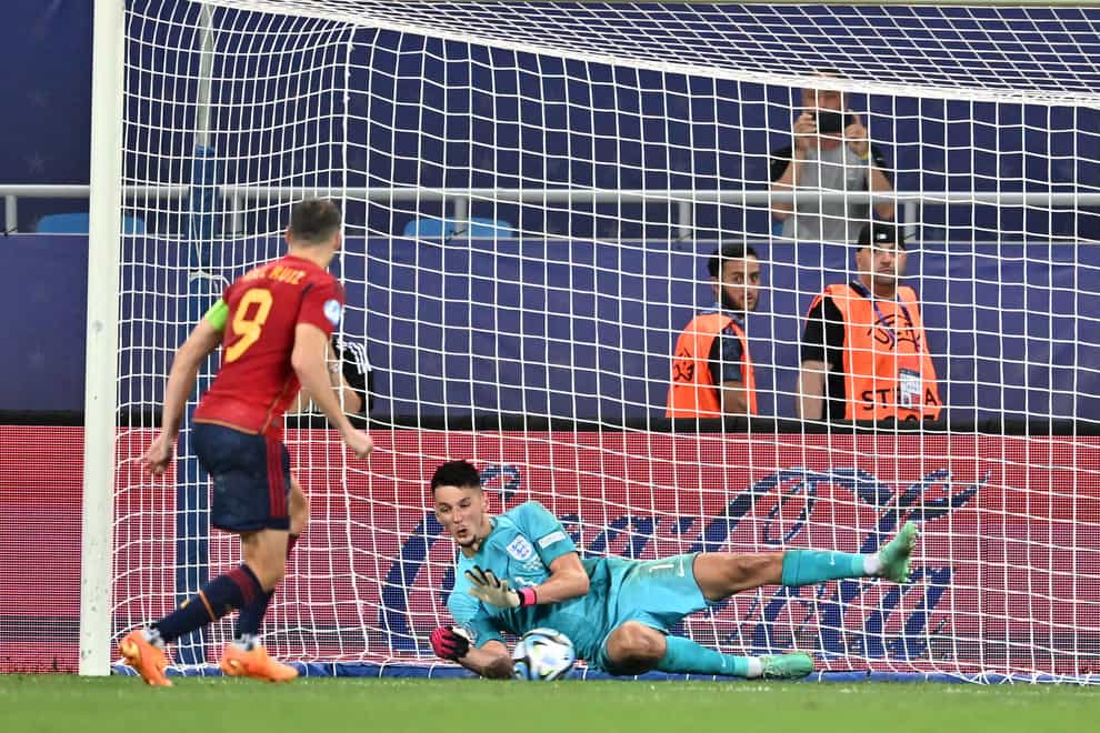 England goalkeeper James Trafford saves Abel Ruiz’s last-gasp penalty in the European Under-21 Championship final (PA)