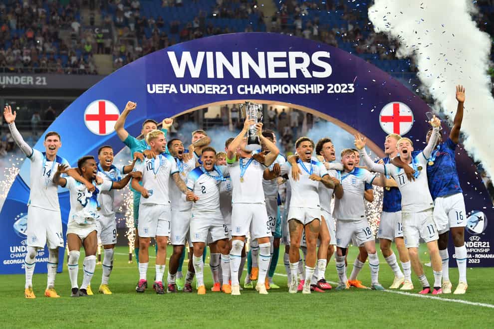 England players celebrate with the trophy (PA).