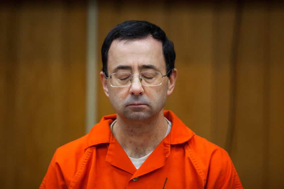 Larry Nassar, who was convicted of sexually abusing female gymnasts, was stabbed multiple times during an altercation at a federal prison in Florida (Cory Morse/The Grand Rapids Press/AP)