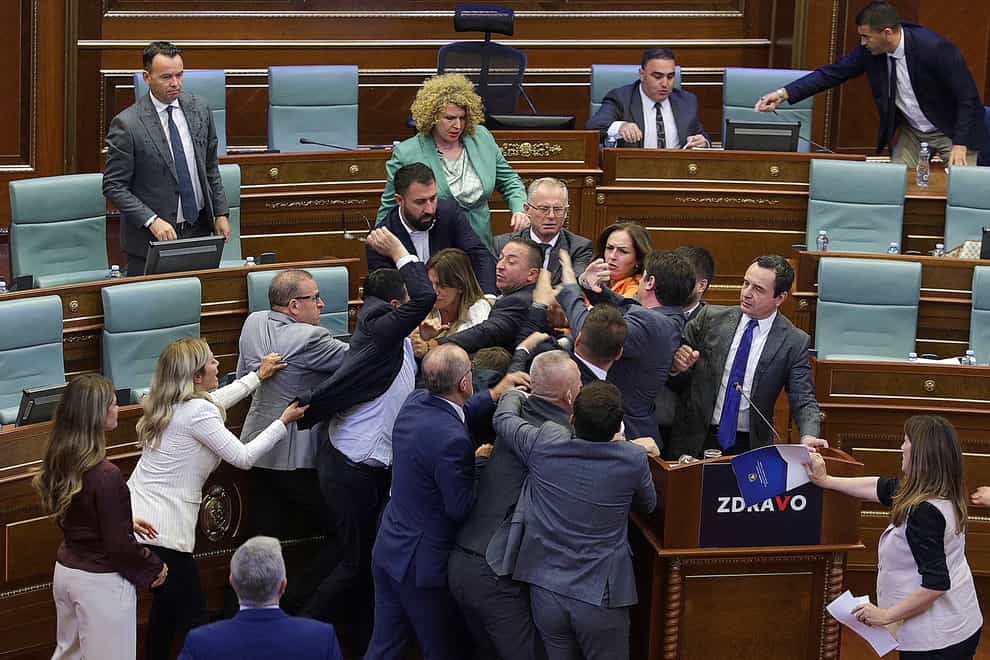Legislators push each other as a brawl breaks out in Kosovo’s parliament in Pristina (Ridvan Slivova/AP)