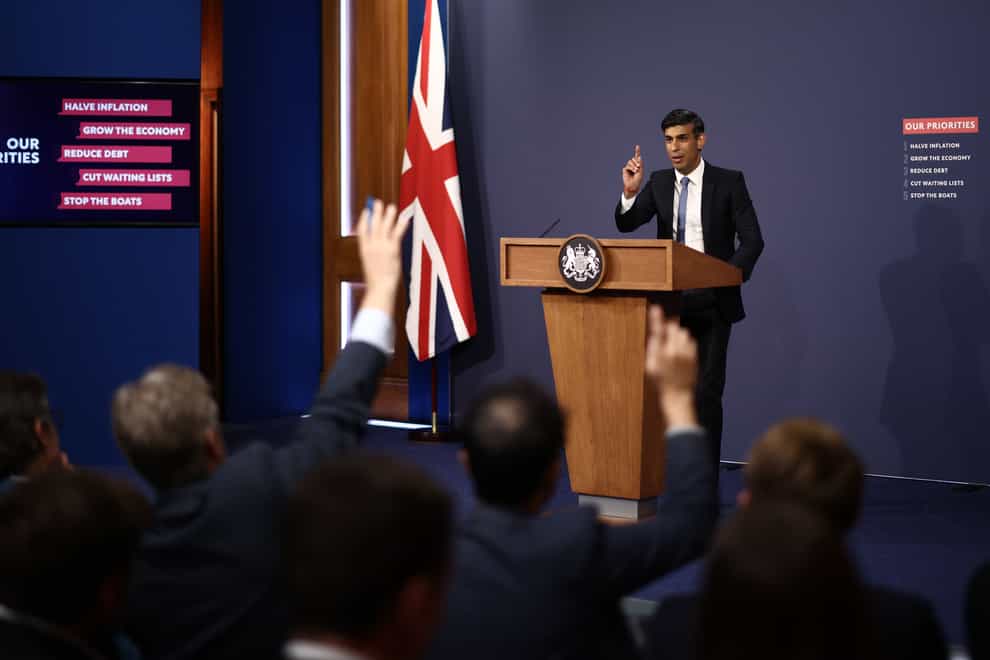 Rishi Sunak has announced that millions of public sector workers pay rises of up to 6.5% but spending cuts may be required in order to fund them (Henry Nicholls/PA)