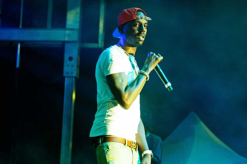 Young Dolph performing at The Parking Lot Concert in Atlanta in 2020. A judge has set a trial date for two men charged with killing him (Paul R Giunta/Invision/AP/PA)