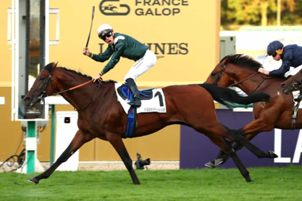 Cristian Demuro celebrates with Feed The Flame (France Galop)