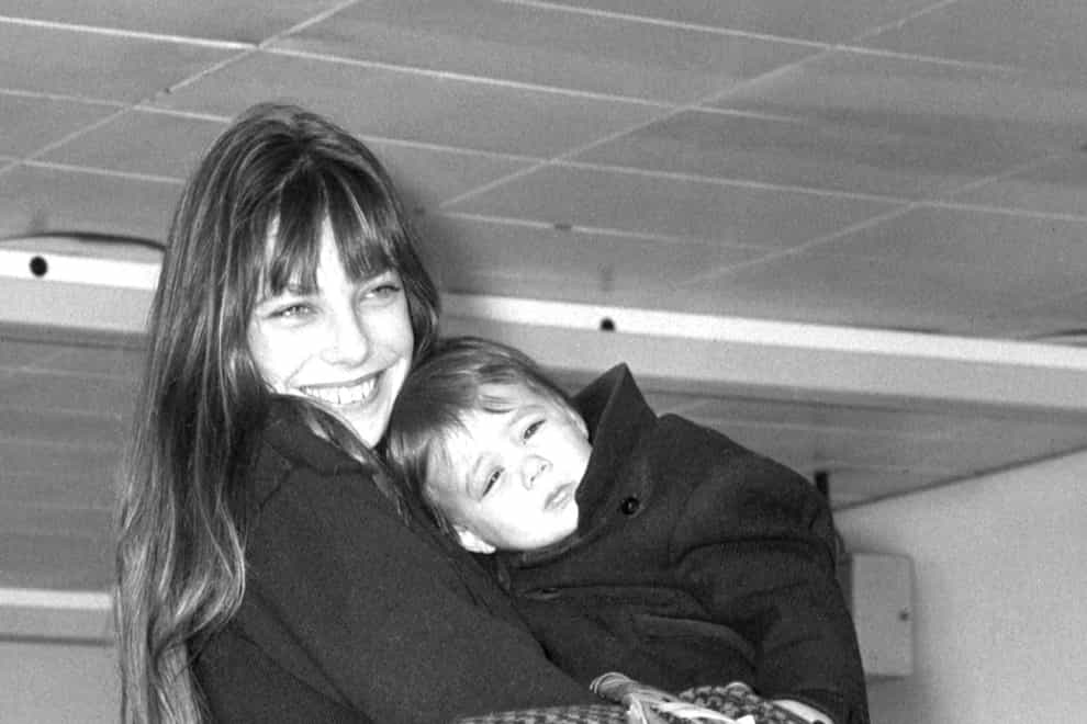 Actress Jane Birkin with her 18-month-old daughter Charlotte at London’s Heathrow Airport in December 1972 (PA)
