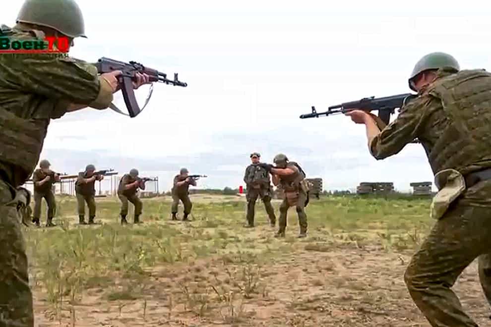 Belarusian soldiers attend a training by mercenary fighters from Wagner private military company near Tsel village, about 55 miles south-east of Minsk (Belarusian Defence Ministry via VoenTV via AP)