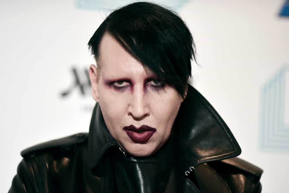 Marilyn Manson is accused of spitting and blowing his nose on a videographer at a 2019 concert (Richard Shotwell/Invision/AP)