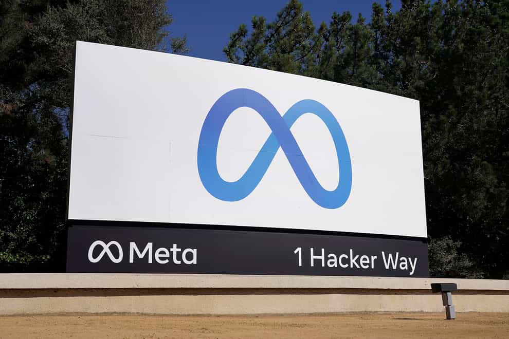 Facebook’s Meta logo sign at the company headquarters in Menlo Park, California (Tony Avelar/AP)