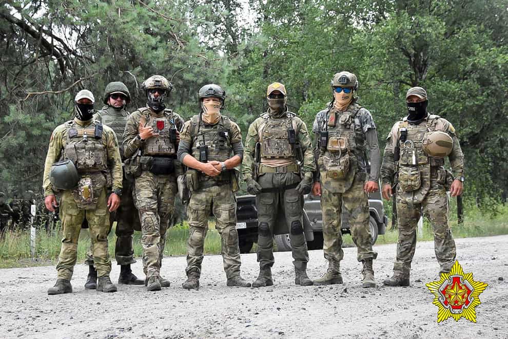 Belarusian soldiers of the Special Operations Forces (SOF) and mercenary fighters from Wagner private military company pose for a photo near the border city of Brest, Belarus (Belarus Defence Ministry via AP/PA)