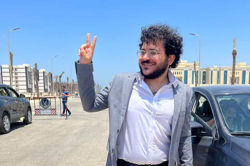 Patrick George Zaki, a prominent Egyptian rights activist with ties to Italy, outside the Dakahlia security headquarters in Mansoura, Egypt, after he was pardoned by Egyptian President Abdel Fattah el-Sissi along with five other people (Marise George via AP/PA)