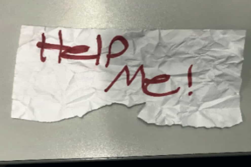 The ‘help me!’ sign used by a 13-year-old girl kidnapped in Texas (US Department of Justice via AP/PA)