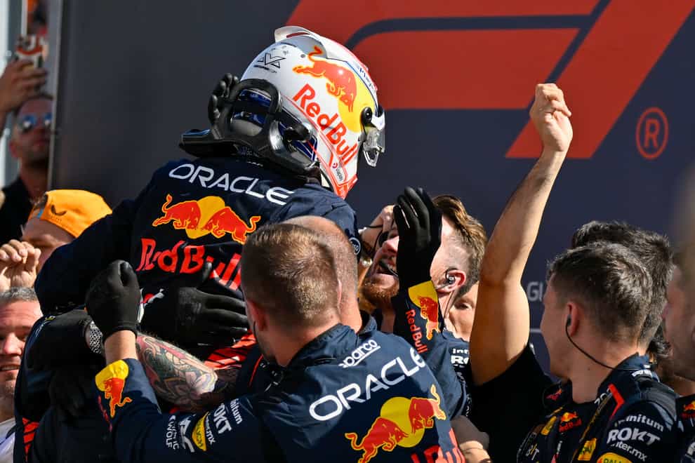 Dutch Formula One driver Max Verstappen of Red Bull Racing celebrates with his team after winning the Formula One Hungarian Grand Prix auto race, at the Hungaroring racetrack in Mogyorod, near Budapest, Hungary, Sunday, July 23, 2023. (AP Photo/Denes Erdos)