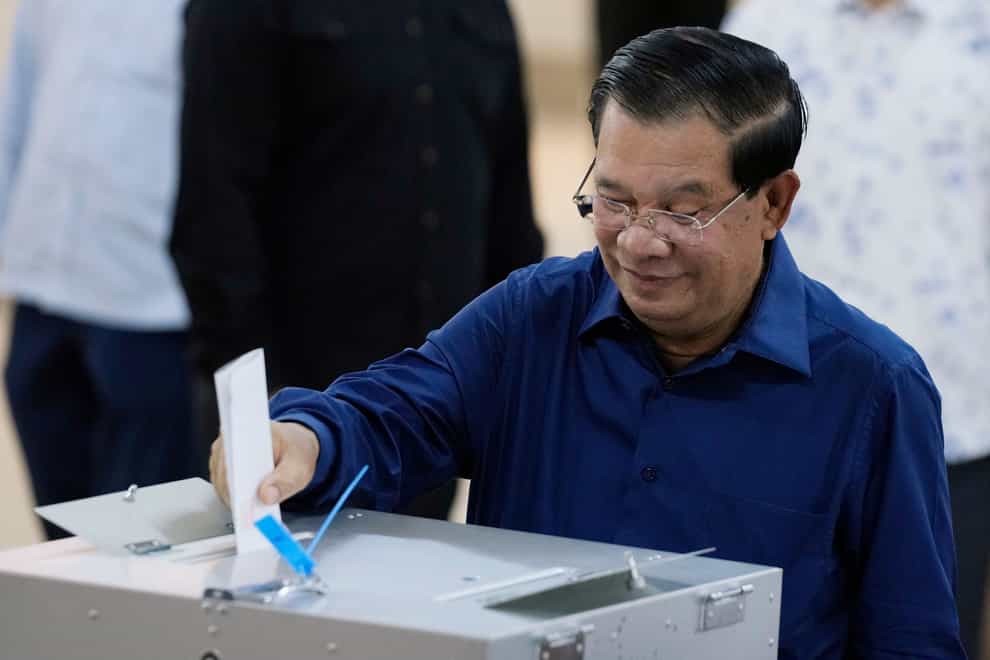 Cambodian Prime Minister Hun Sen cast his vote shortly after the polls opened (Heng Sinith/AP)