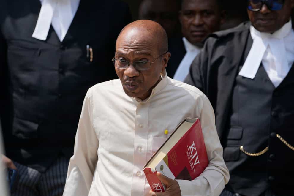 Godwin Emefiele, suspended Central Bank governor, leaves after a court hearing at the Federal High Court in Lagos, Nigeria (Sunday Alamba/AP/PA)
