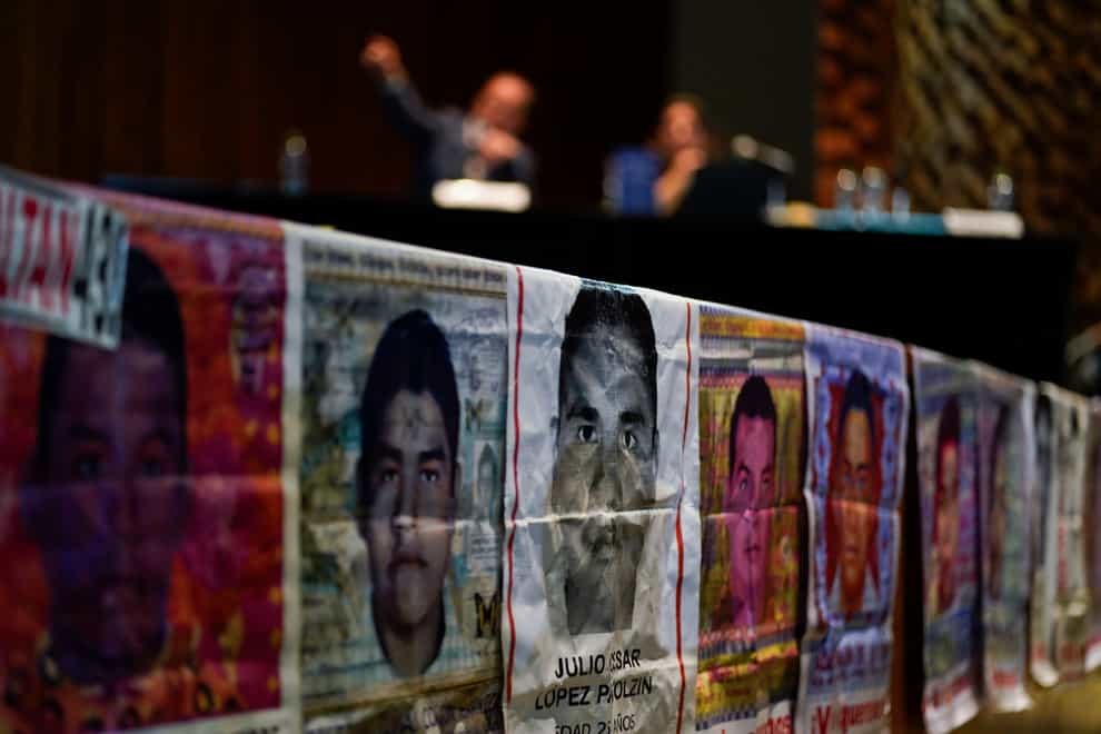 Photographs of missing students are displayed during a press conference by the Interdisciplinary Group of Independent Experts (GIEI) in Mexico City on Tuesday (Eduardo Verdugo/AP/PA)