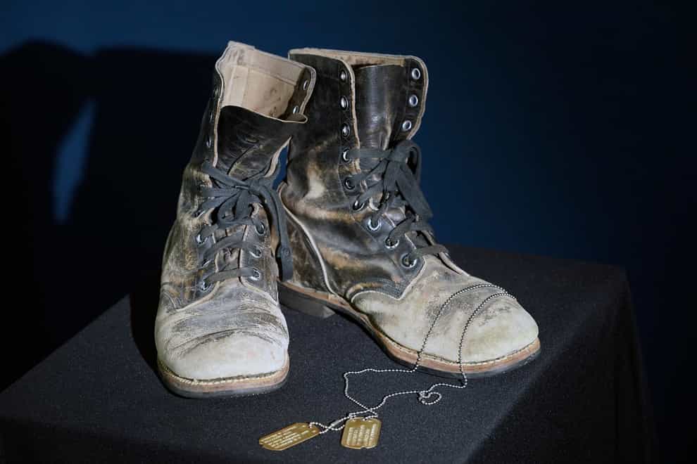 Combat boots and dog tags worn by Alan Alda have been sold at auction (LM Otero/AP)