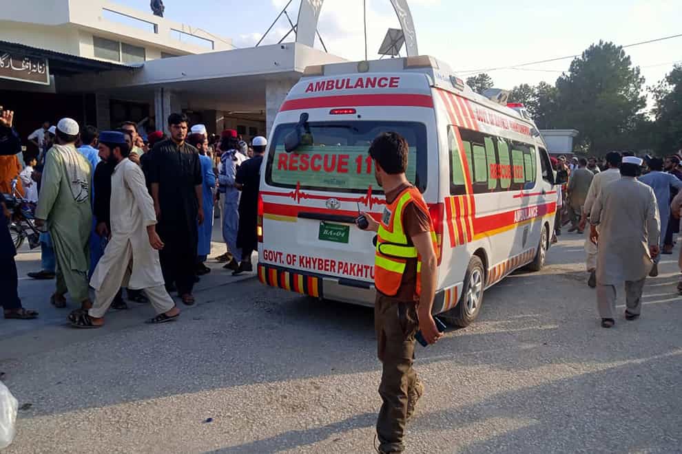An ambulance carries injured people after a bomb explosion in the Bajur district in Pakistan (Rescue 1122 Head Quarters via AP)