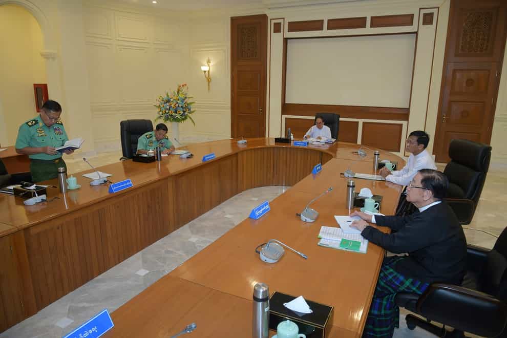 Vice Senior Gen Soe Win, left, deputy chairman of State Administration Council, speaks during a meeting with members the National Defence and Security Council including Gen Min Aung Hlaing, temporary president of the military government Myint Swe, Vice President Henry Van Thio and T Khun Myat, speaker of Union Parliament (The Military True News Information Team via AP/PA)