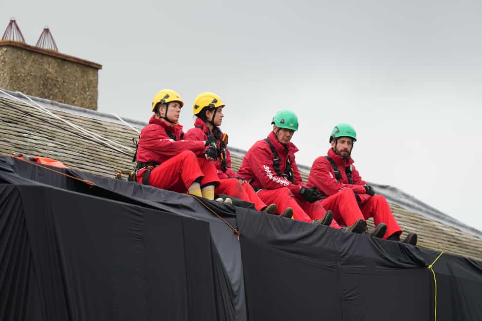 Greenpeace activists on the roof of Prime Minister Rishi Sunak’s house (Danny Lawson/PA)