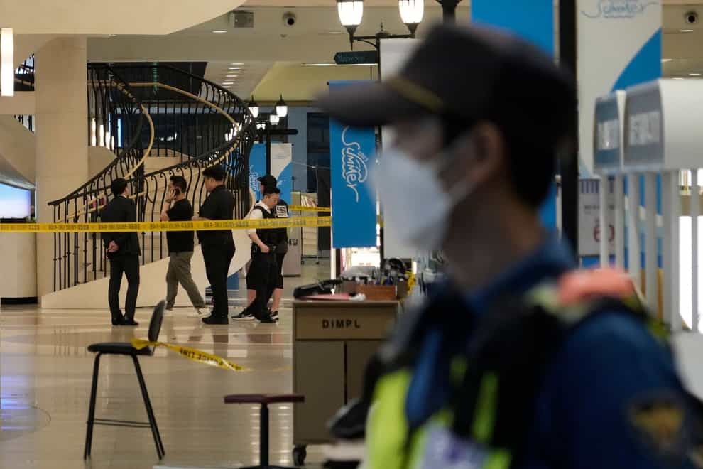 Police officers cordon off the scene near a subway station in Seongnam, South Korea (Ahn Young-joon, PA)
