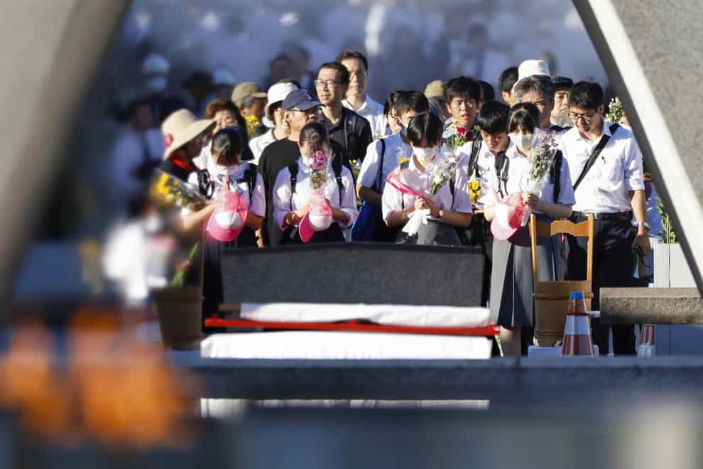 Visitors paid their respects at a cenotaph dedicated to the victims of the atomic bombing in the Hiroshima Peace Memorial Park (Kyodo News/AP)