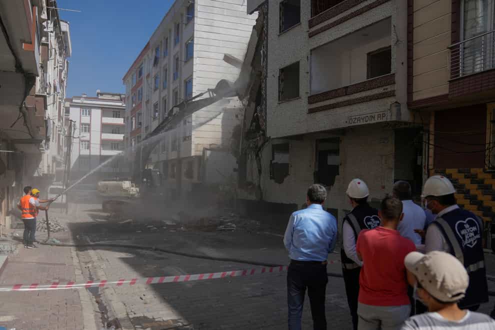 An apartment building has been demolished in Istanbul, Turkey, after being deemed unsafe following the massive quake six months ago (Khalil Hamra/AP)