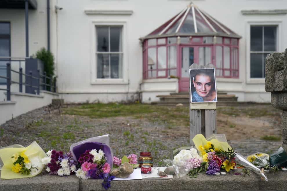 Floral tributes laid outside Sinead O’Connor’s former home in Bray (Brian Lawless/PA)