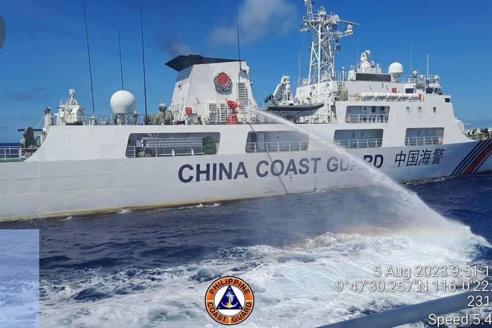 A Chinese coast guard ship uses water canons on a Philippine Coast Guard ship (Philippine Coast Guard via AP)