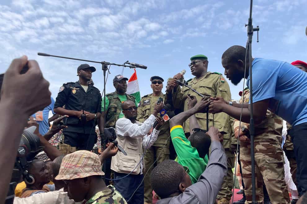 Mohamed Toumba, one of the soldiers who ousted Nigerian President Mohamed Bazoum, addresses supporters of Niger’s ruling junta in Niamey (AP)