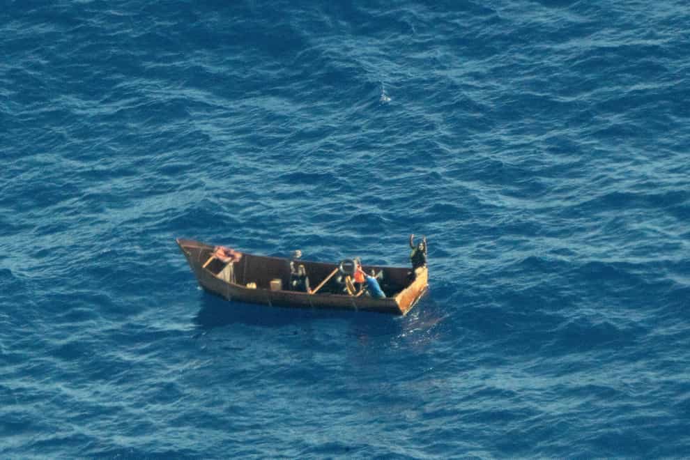 Four migrants, rescued by a passing merchant ship, have told doctors and police that waves swamped their boat. Some 41 others are missing and presumed dead. (Karolina Sobel/Sea-Watch/AP)