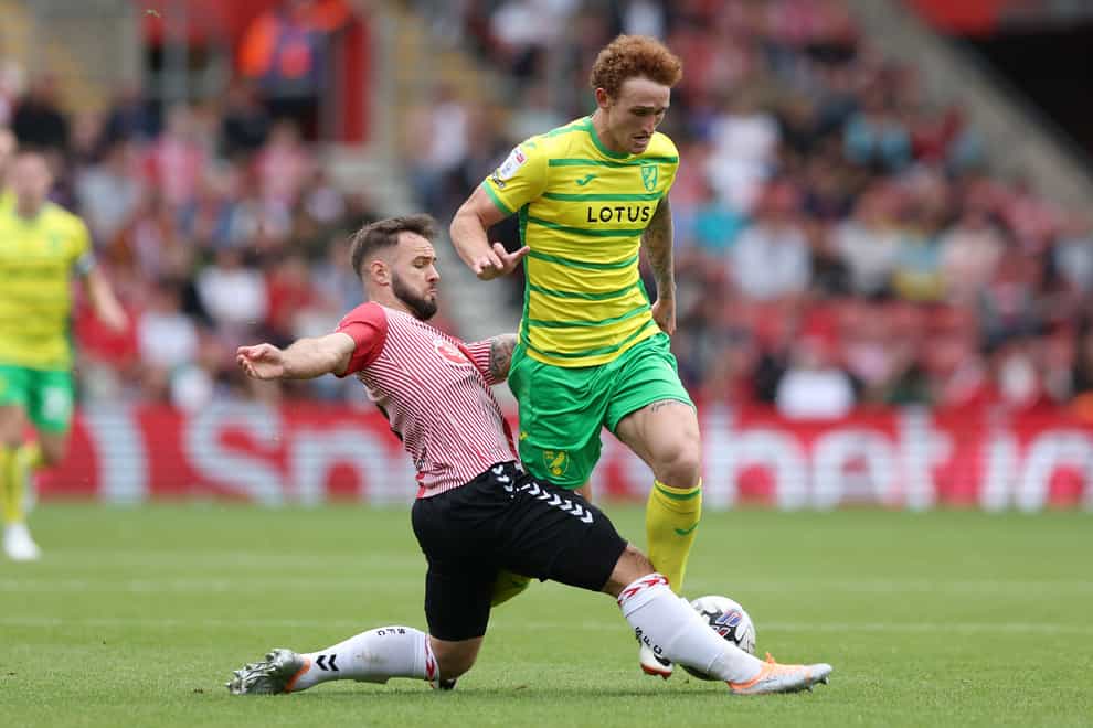 Josh Sargent is tackled by Adam Armstrong (Kieran Cleeves/PA)