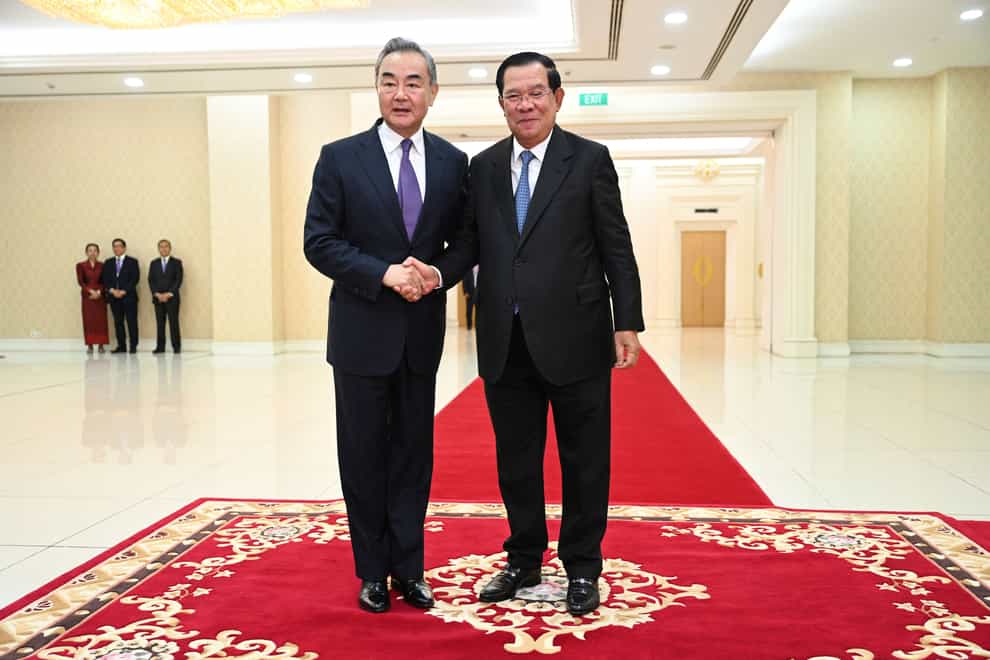 Chinese Foreign Minister Wang Yi visited Cambodia to reaffirm his country’s commitment to the south-east Asian country after Prime Minister Hun Sen handed the role to his son following a one-sided election (Kok Ky/Cambodia’s Government Cabinet/AP)