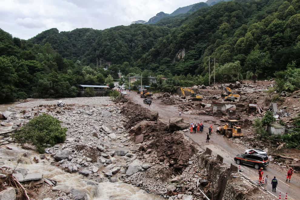 The mudslide was caused by torrential rain (Zou Jingyi/Xinhua via AP)