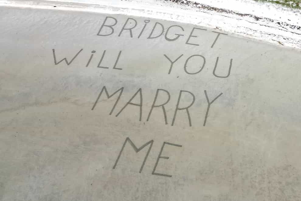 Airport staff wrote Mr McCann’s proposal to his partner in the sand (Stephen McCann/Big Partnership/PA)