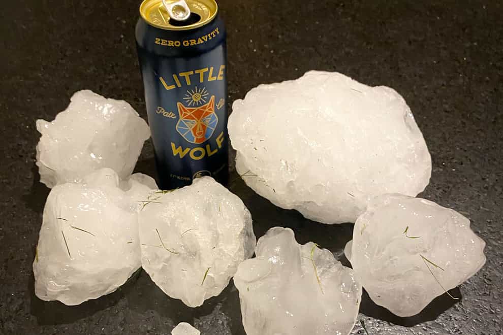 Pieces of ice gathered after a chunk of ice crashed on to the roof of a house in Shirley, Massachusetts (Jeff Ilg via AP)