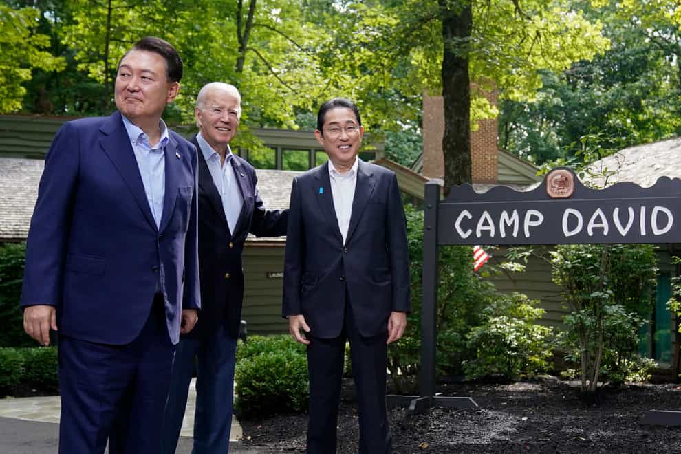 South Korea’s President Yoon Suk Yeol, left, US President Joe Biden and Japan’s prime minister Fumio Kishida (Andrew Harnik/AP)