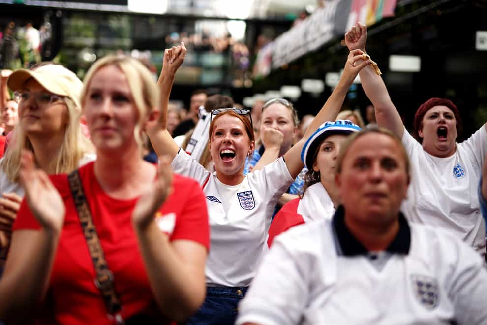 England fans celebrate after seeing England goalkeeper Mary Earps make a penalty save during a screening of the Fifa Women’s World Cup 2023 final between Spain and England at BOXPARK Croydon, London (Aaron Chown/PA)