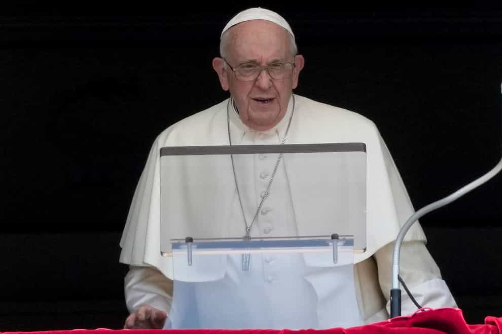 Pope Francis delivers his blessing as he recites the Angelus noon prayer from the window of his studio overlooking St Peter’s Square (Andrew Medichini/AP/PA)