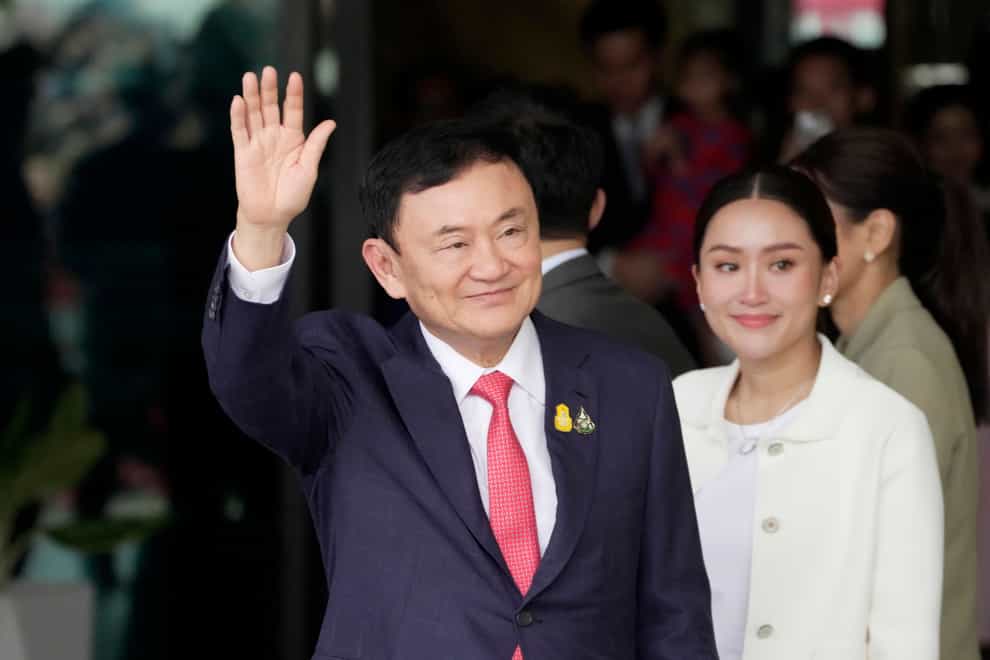 Divisive ex-prime minister Thaksin Shinawatra returned to Thailand on Tuesday after years of self-imposed exile to face possible criminal penalties on the same day that a party affiliated with him plans to start forming a new government (Sakchai Lalit/AP)